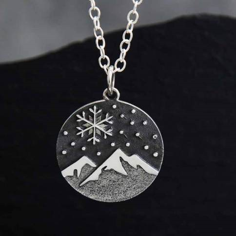 Sterling silver mountain and snowflake necklace